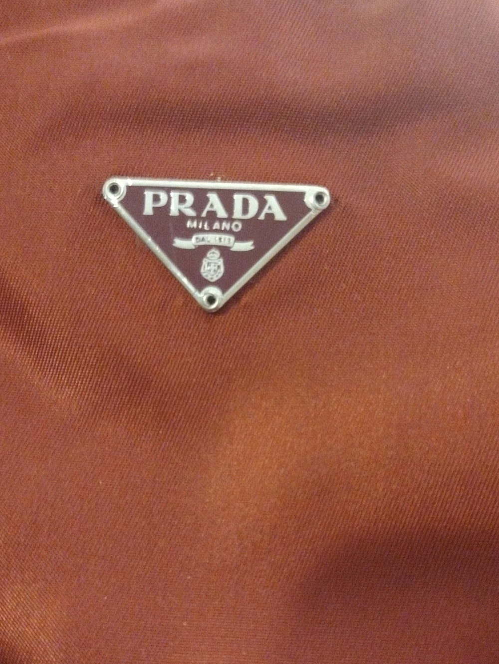 Prada Mini Bag in Rust Orange Nylon with Silver Triangle Logo